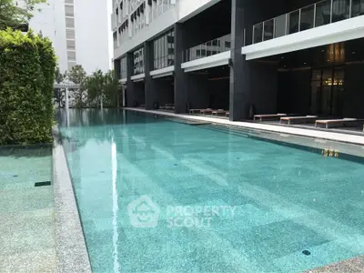 Luxurious modern apartment complex with a stunning outdoor pool area.