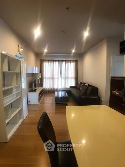 Spacious living room with modern furnishings and ample natural light