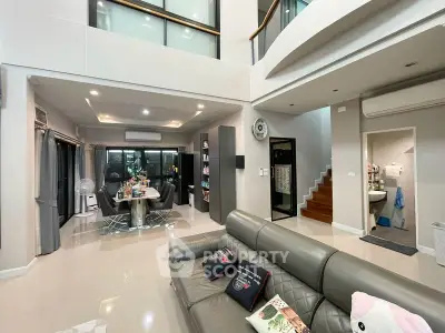 Spacious modern living room with high ceilings and elegant decor