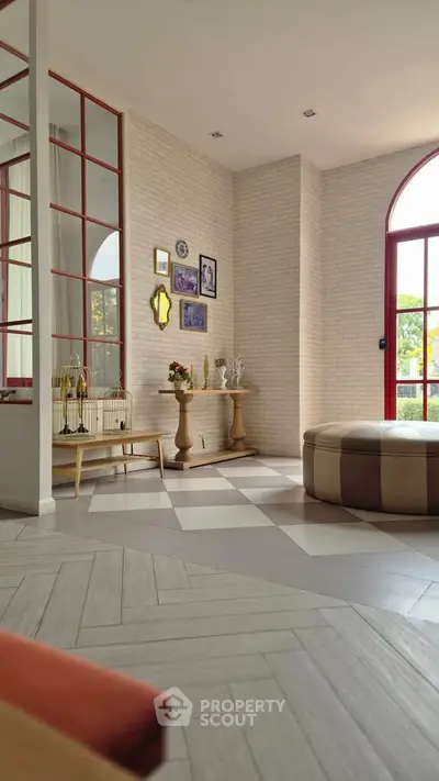 Stylish modern living room with elegant decor and large windows for natural light.