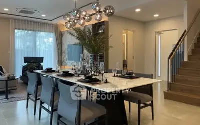 Luxurious dining area with elegant decor and modern lighting in a stylish home interior.