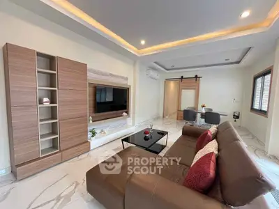 Modern living room with stylish furniture and elegant lighting