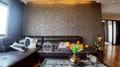 Stylish living room with modern leather sofa and decorative accents