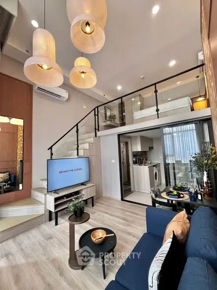 Modern loft apartment with stylish living room and mezzanine bedroom, featuring open layout and chic decor.