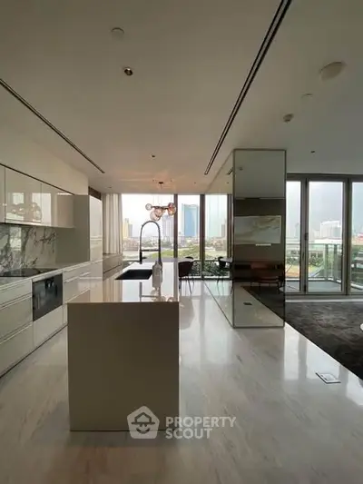 Luxurious modern kitchen with marble island and stunning city view