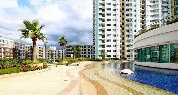 Luxurious apartment complex with stunning pool and modern architecture.