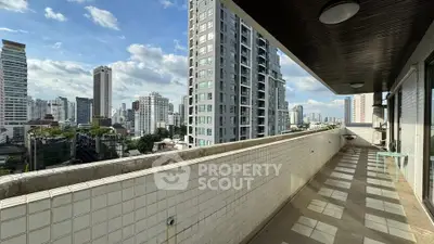 Spacious balcony with stunning cityscape views in modern high-rise building