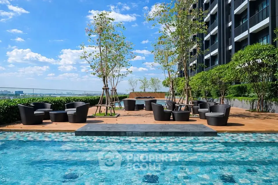 Luxurious rooftop pool area with modern seating and stunning city views.