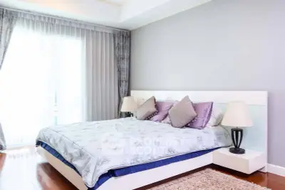 Spacious and elegant bedroom with modern decor and natural light