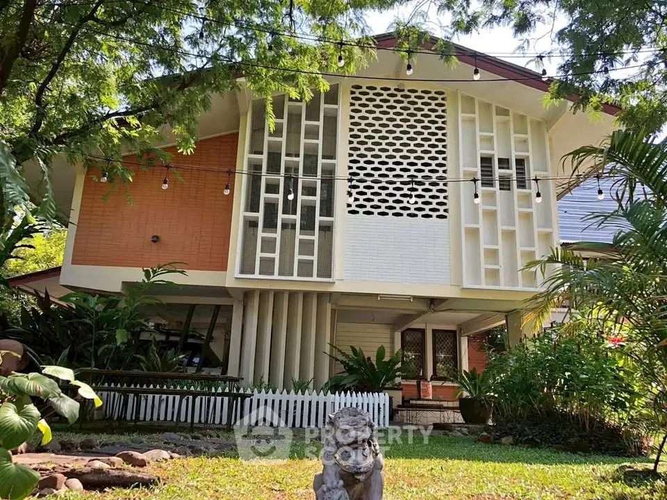 Charming mid-century modern home with unique architectural design and lush garden setting.