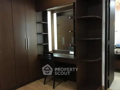 Elegant wooden wardrobe with built-in vanity in modern bedroom
