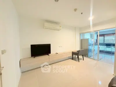 Spacious modern living room with sleek furniture and natural light