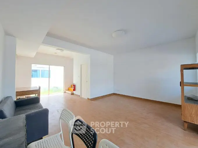 Spacious living room with modern minimalist design and natural light