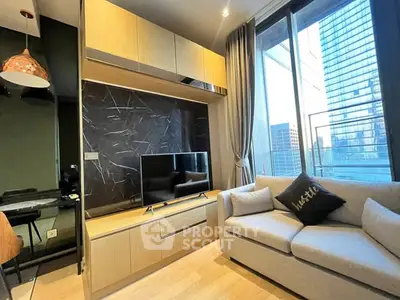 Modern living room with city view, stylish decor, and cozy seating area.