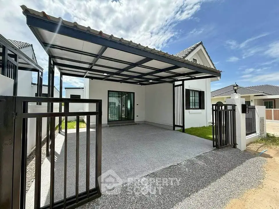 Modern single-story house with spacious carport and sleek design