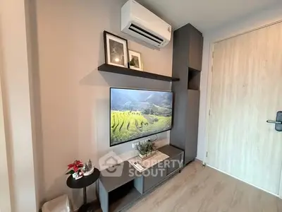 Modern living room with wall-mounted TV and air conditioner