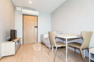 Modern living room with minimalist furniture and wooden flooring