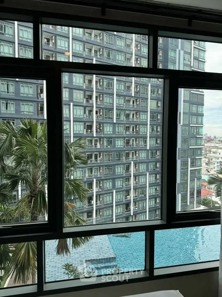 Stunning high-rise apartment view with pool and cityscape