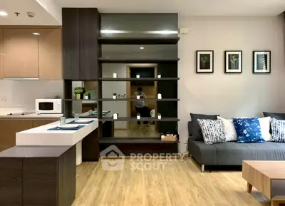 Modern living room with stylish decor and open kitchen layout