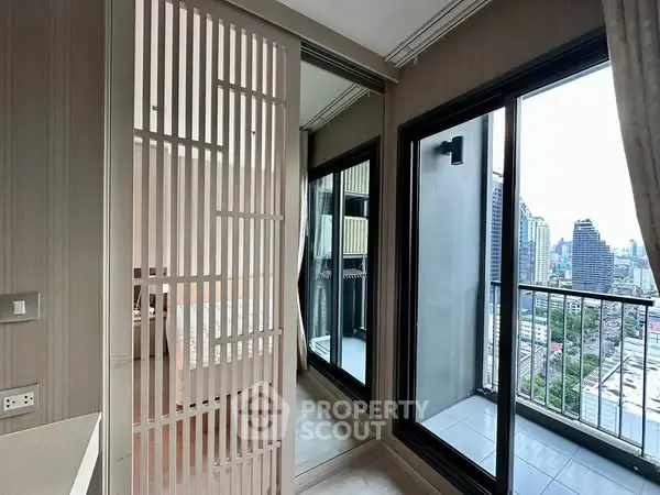 Modern apartment with city view and balcony access from bedroom