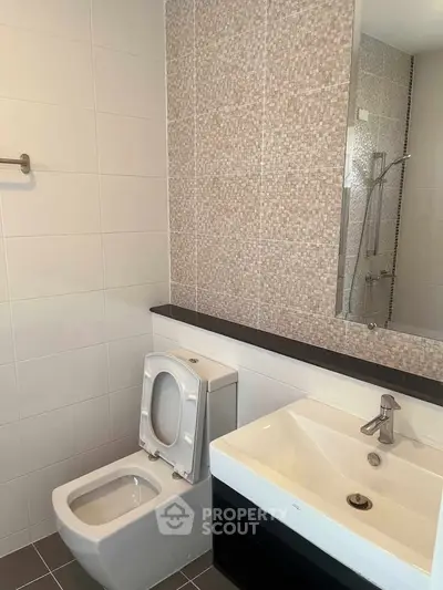 Modern bathroom with sleek fixtures and stylish tile design