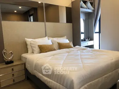 Luxurious bedroom with modern decor and ample natural light