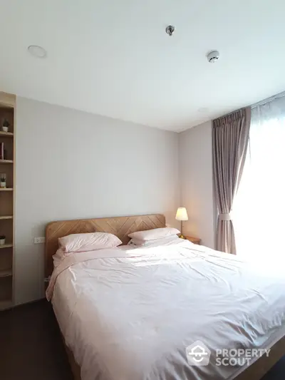 Bright and cozy bedroom with natural light and elegant decor