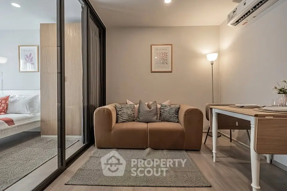 Modern living room with cozy sofa and stylish decor in a contemporary apartment.