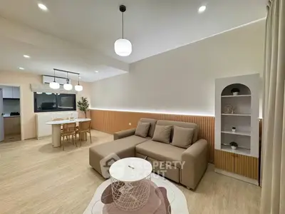 Modern living room with cozy sofa and stylish dining area