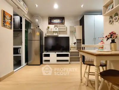 Charming modern living room with stylish decor and open kitchen layout, perfect for cozy urban living.