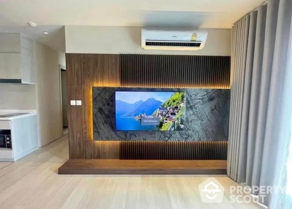 Modern living room with stylish TV wall and air conditioning