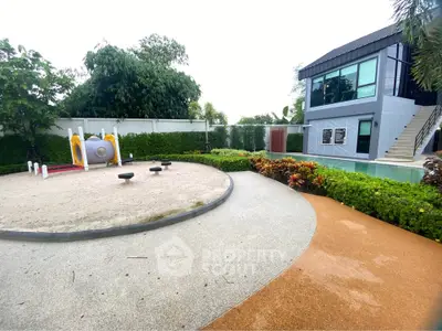 Modern residential playground with lush greenery and contemporary building exterior