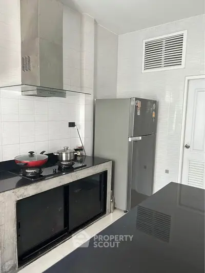 Modern kitchen with sleek appliances and minimalist design