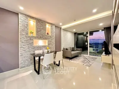 Modern living room with stylish decor and sunset view balcony.
