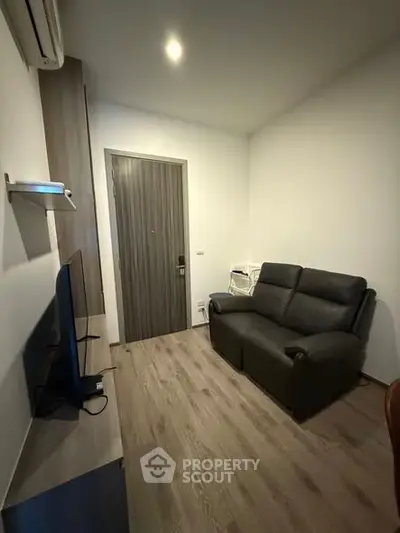 Cozy living room with modern furniture and sleek wooden flooring