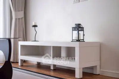 Modern minimalist living room with stylish white furniture and elegant decor