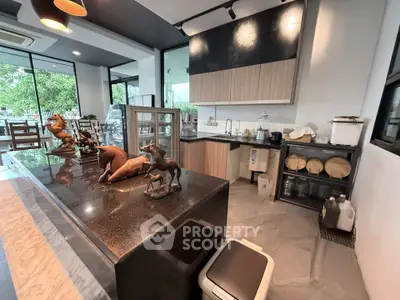 Modern kitchen with sleek countertops and stylish decor in a contemporary home setting.