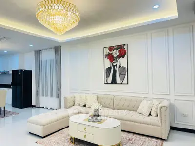 Luxurious living room with elegant chandelier and modern decor