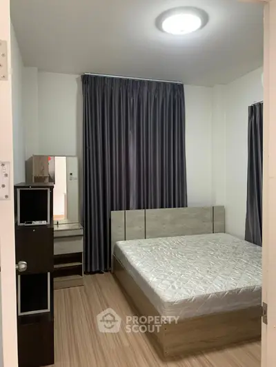 Cozy bedroom with modern furnishings and wooden flooring