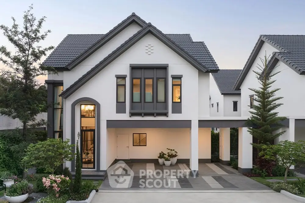 Stunning modern two-story house with elegant facade and lush landscaping