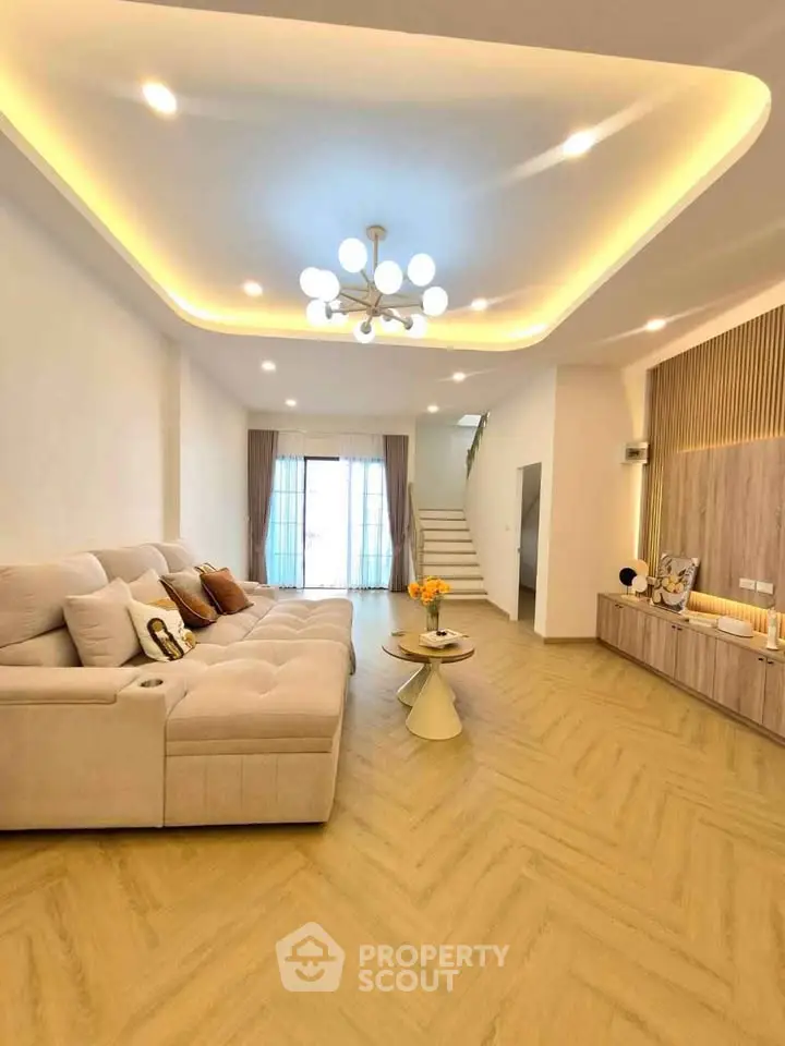Spacious modern living room with elegant lighting and stylish decor