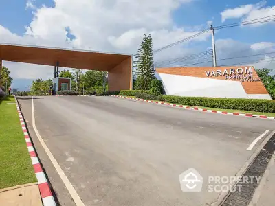 Luxurious entrance of Vararom Premium housing estate with modern design and lush greenery.