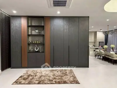 Luxurious open-plan living area with elegant dining space and modern kitchen.