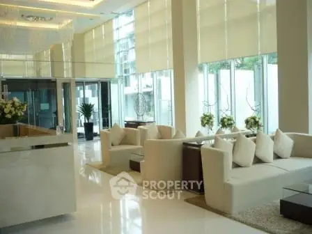 Luxurious modern lobby with elegant seating and floor-to-ceiling windows
