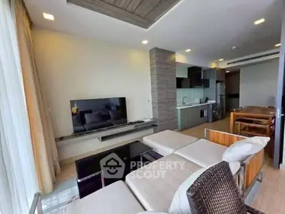 Modern living room with open kitchen and stylish furniture