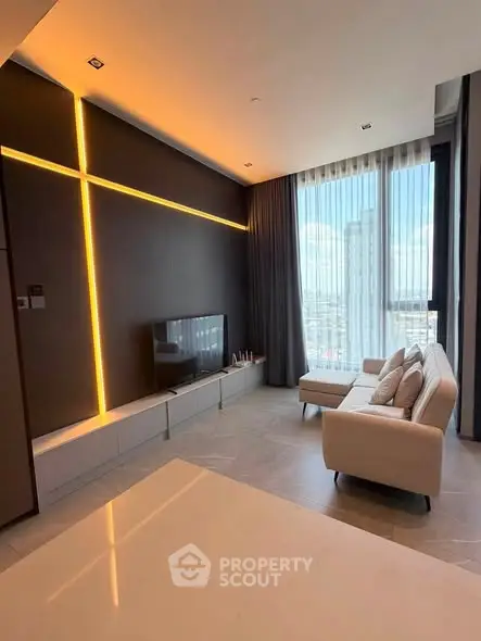 Modern living room with sleek design and large window offering city view