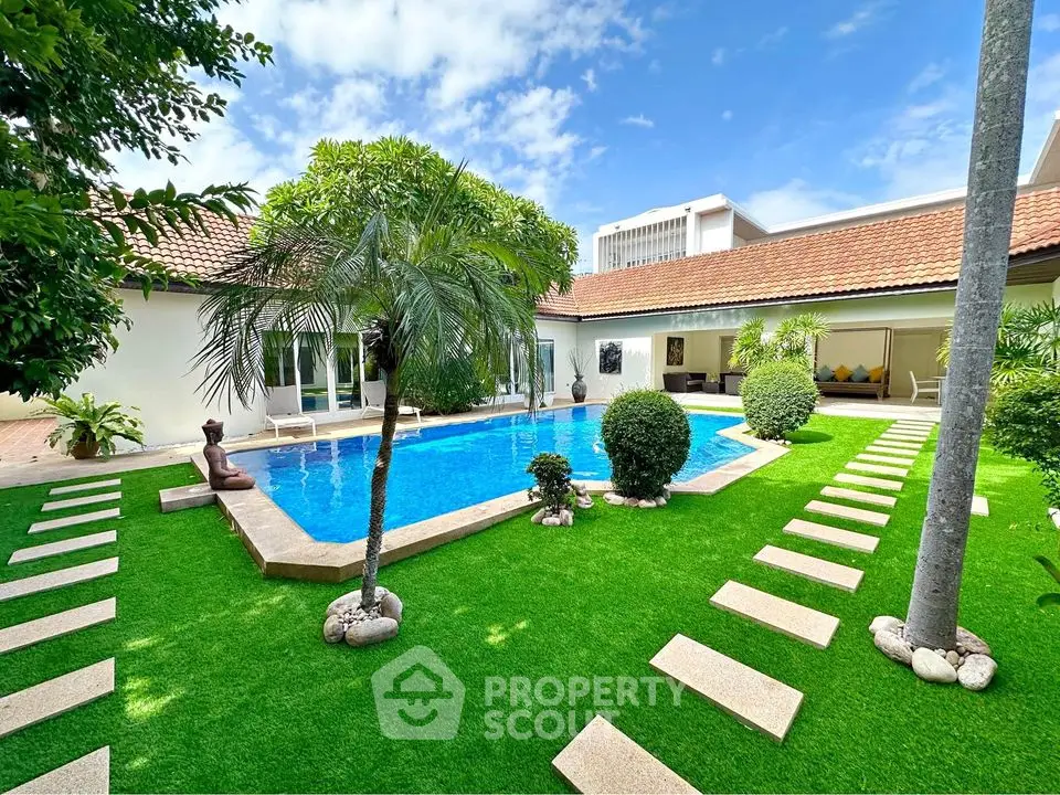 Luxurious villa with private pool and lush garden, perfect for relaxation and entertaining.