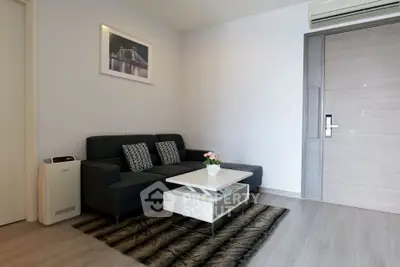 Modern living room with sleek furniture and stylish decor in a contemporary apartment.