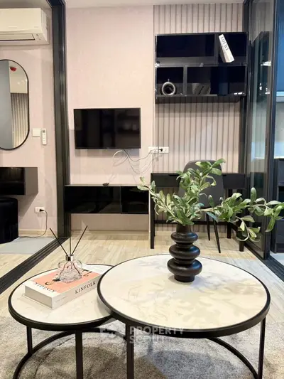 Modern living room with stylish decor and sleek furniture design.