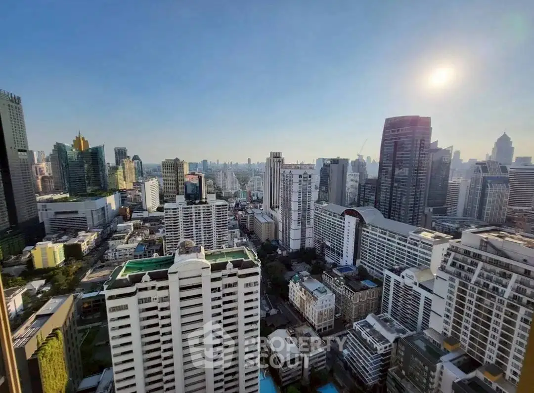 Stunning cityscape view from a high-rise building showcasing urban skyline and architecture.